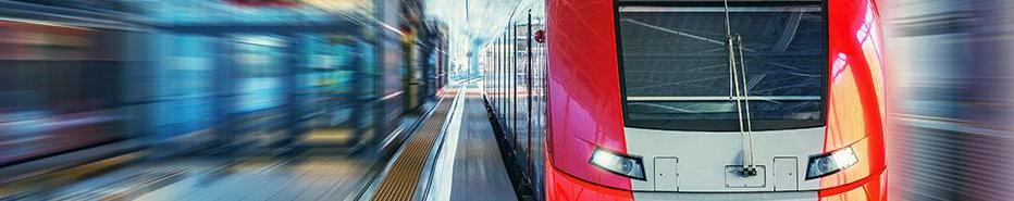 Passenger high speed train moves fast along the railway station platform.